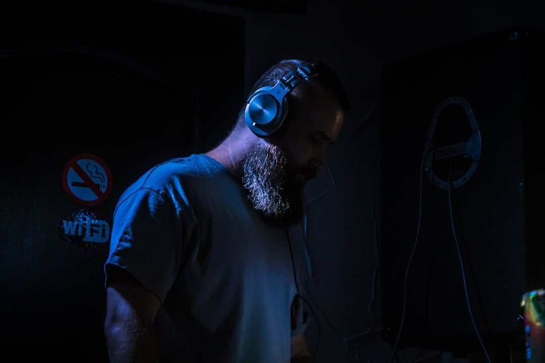 Studio manager, a man with short beard in headset